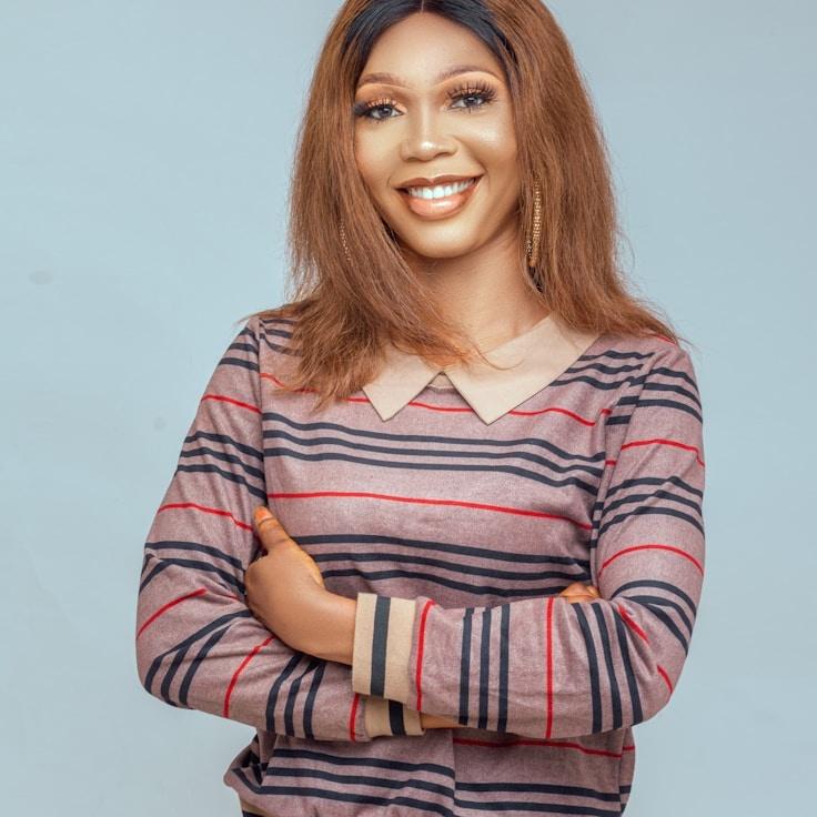 Kaveri Mehta, Lead Design Curator at Grove Quartz Studio, reviewing corporate floral arrangements